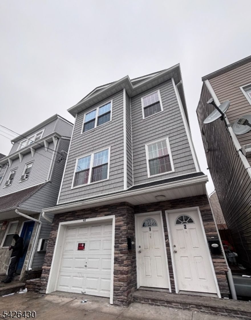 Welcome to this modern two-family house, built in 2023 and thoughtfully designed for comfortable living and investment potential. The first floor features 2 bedrooms, kitchen, LR/DR combo, storage and 1 full bathroom. The second unit offers a unique two-level layout, showcasing modern living at its finest. It includes 3 bedrooms,  a spacious eat-in kitchen, living room, dining room and 2 full bathrooms. The property also includes an attached one-car garage.
