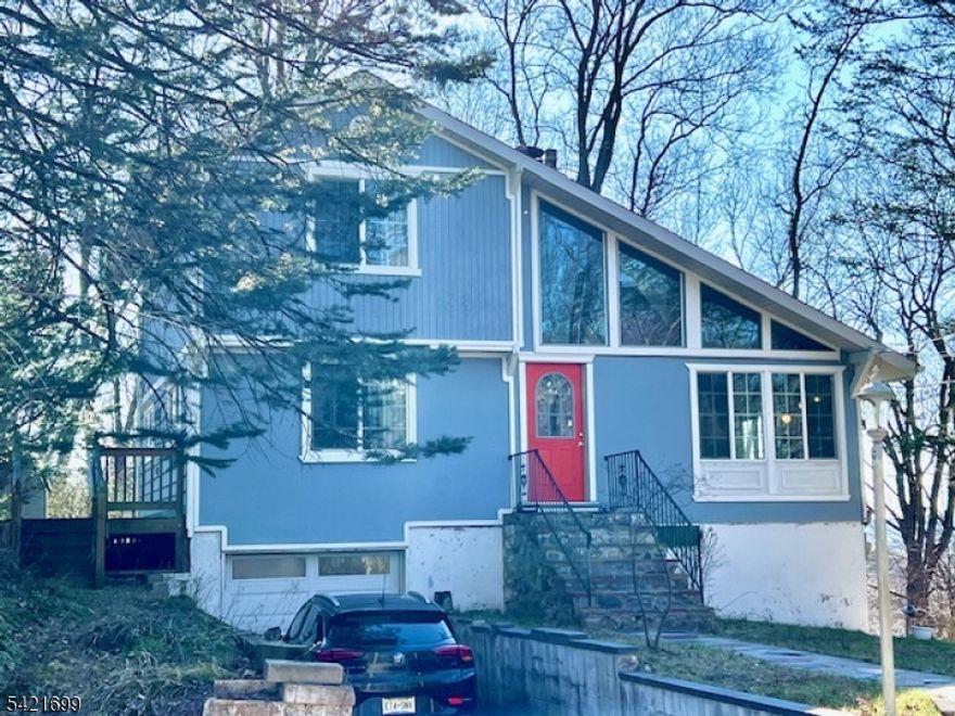 3 Bedroom Custom home with contemporary flair on wooded oversized lot Home boasts  Liv Rm w/ vaulted ceiling, new bath, new furnace, new roof, new windows a 1st floor master & sliders from Din Rm to wrap around deck/patio in Hardyston's Scenic Lake Community.