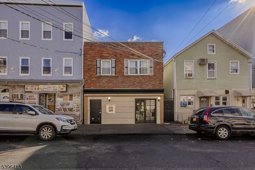 Prime location in the heart of the Ironbound! This versatile mixed-use property features a retail/office storefront on the first floor ideal for a variety of uses such as office, medical, or retail. The second floor includes two apartments, providing great income potential. Excellent opportunity for investors or owner-occupants seeking a live/work setup. Conveniently located near major highways, transportation, shopping, and restaurants.