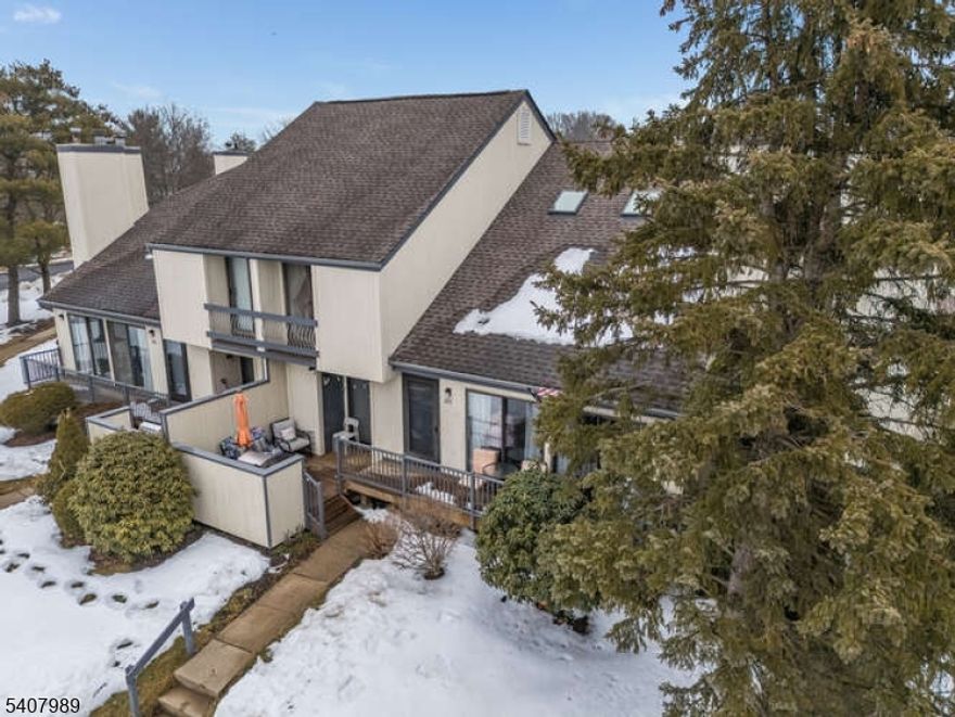 WELCOME TO THIS BEAUTIFULLY UPDATED 2 BED, 2.5 BATH MULTI-LEVEL TOWNHOUSE FEATURING A LIGHT-FILLED OPEN CONCEPT LAYOUT IN THE CEDARS, ONE OF BASKING RIDGE'S MOST SOUGHT-AFTER COMMUNITIES. THE HEART OF THE HOME IS THE EXPANSIVE LIVING ROOM, WHERE SOARING VAULTED CEILINGS AND A DRAMATIC WALL OF WINDOWS CREATE AN AIRY, OPEN ATMOSPHERE. A COZY WOOD-BURNING FIREPLACE SERVES AS THE FOCAL POINT, WHILE SLIDING GLASS DOORS LEAD TO A PRIVATE, SPACIOUS DECK. NOTABLY, THIS OUTDOOR RETREAT FEATURES A RARE NATURAL GAS LINE THAT HOOKS DIRECTLY INTO YOUR GRILL. THE SEAMLESS FLOW CONTINUES INTO THE FORMAL DINING ROOM. THE KITCHEN HAS BEEN TASTEFULLY UPDATED WITH A FULL SUITE OF PREMIUM STAINLESS STEEL APPLIANCES AND FEATURES AMPLE CABINETRY, A LARGE PANTRY, A SPACIOUS EAT-IN AREA, AND ACCESS TO THE UNIT'S ATTACHED GARAGE. THE SECOND LEVEL IS DESIGNED WITH PRIVACY IN MIND; BOTH BEDROOMS FEATURE GENEROUS CLOSETS AND PRIVATE BATHROOMS. THE PRIMARY SUITE'S BATHROOM HAS BEEN COMPLETELY RENOVATED AND FEATURES A HIGH-END SHOWER. A STANDOUT FEATURE IS THE VERSATILE BONUS LOFT, ILLUMINATED BY SKYLIGHTS AND OPEN TO THE LIVING ROOM BELOW. A BEAUTIFULLY FINISHED BASEMENT EXPANDS THE LIVING SPACE, PROVIDING THE PERFECT OPPORTUNITY FOR A HOME OFFICE OR RECREATION. RESIDENTS ENJOY PREMIUM COMMUNITY AMENITIES, INCLUDING A POOL, TENNIS COURTS, PLAYGROUND, AND CLUBHOUSE. SITUATED IN THE PRESTIGIOUS BERNARDS TOWNSHIP SCHOOL DISTRICT, THIS HOME IS A COMMUTER'S DREAM, LOCATED JUST MINUTES FROM RT-78 AND RT-287.