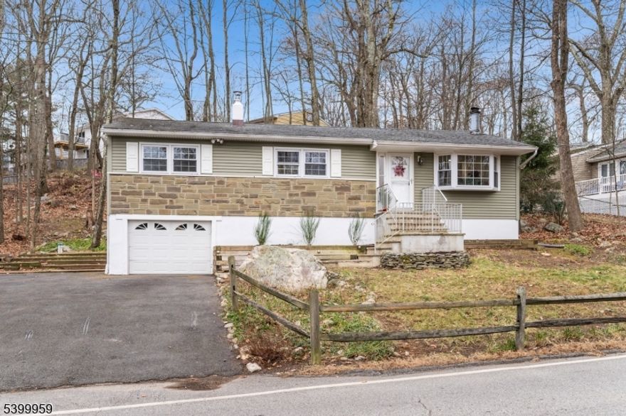 Beautifully Renovated Raised Ranch Home in the Heart of Hopatcong!  Step into modern comfort and timeless style in this freshly updated raised ranch, featuring a brand-new high-end kitchen complete with quartz countertops, custom cabinetry, and sleek finishes perfect for everyday living and entertaining. The home offers refinished hardwood flooring throughout, adding warmth and elegance to every room.Relax in the inviting living area showcasing a cozy wood burning fireplace ideal for holiday gatherings and chilly winter nights. The renovated bathroom blends contemporary design with quality craftsmanship, offering a clean and luxurious feel.Nestled in a quiet neighborhood yet close to Lake Hopatcong recreation, shopping, and major commuting routes, this move-in-ready home offers the best of comfort, convenience, and modern upgrades. Don't miss this opportunity!