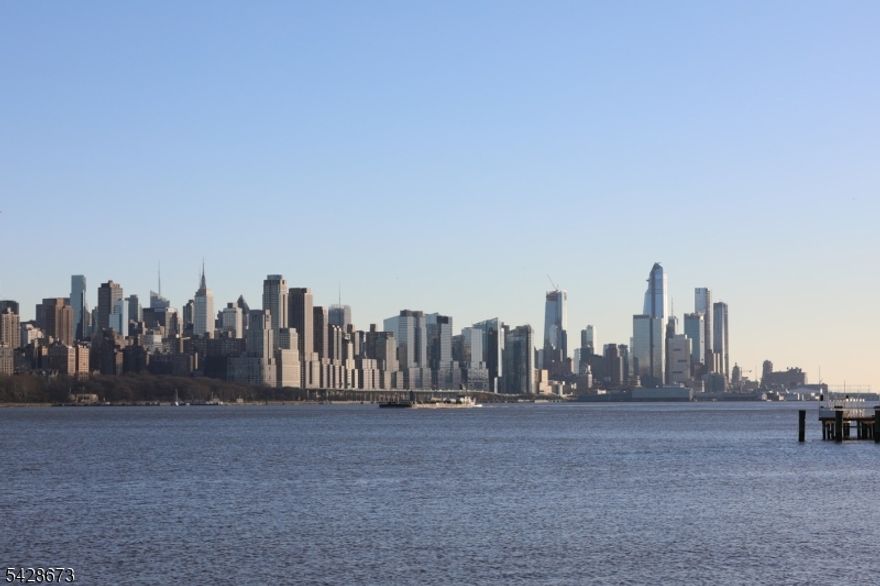 Spacious & upgraded home in the prestigious promenade. South East facing 2 bedroom 2 bath unit, balcony features NYC and Hudson River views. This home has a beautifully updated kitchen that opens up to an oversized living area that is ideal for entertaining. Both bedrooms have custom closets, Bonus Room off of kitchen ideal for den or office. This home also has a private balcony and two parking spots. The promenade is ideally located within walking distance to NJ transit, retail shopping, fine dining, and more. This home is sure to exceed buyer expectations.