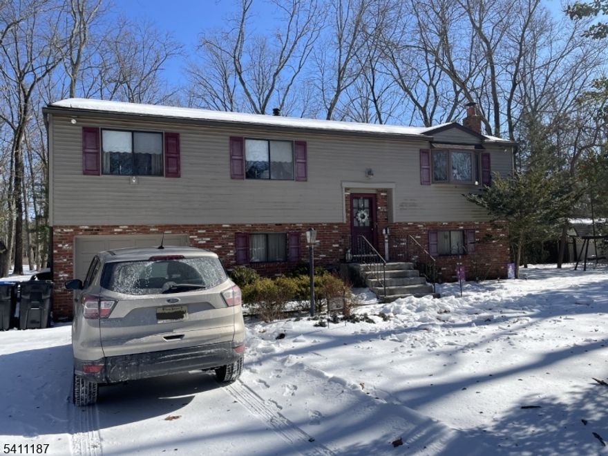 Don't miss this incredible opportunity to own a spacious, bi-level, mother-in-law suite-style home situated on an impressive 120x170 lot! With solid bones, generous living space, and endless potential, this property is ideal for both homeowners and investors. The upper level features 3 well-sized bedrooms, a full bathroom, a bright formal living room, and a separate formal dining room. The cozy kitchen offers plenty of space and layout flexibility to make it your own. The ground-level walkout provides fantastic additional living space, complete with a large family room featuring a charming fireplace, a half bathroom, and a convenient laundry room. Additional highlights include a rear enclosed porch for extra living or recreational space, a 1-car attached garage, and a long driveway with room to park multiple vehicles. With a little vision and cosmetic updates, you can truly bring this property to life and create significant equity. This home delivers space, flexibility, and value. Located in a quiet Atco neighborhood, this home offers easy access to Route 30 (White Horse Pike), the Atlantic City Expressway, and the Atco NJ Transit Train Station with direct service to Philadelphia providing convenient access to shopping, commuting, and shore destinations like Atlantic City.