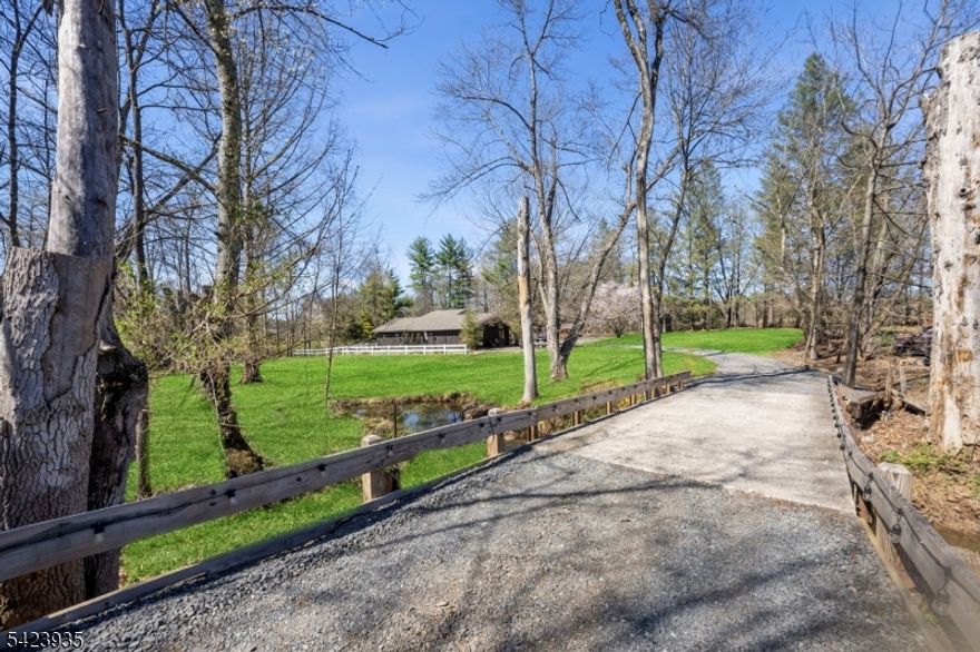 PLEASE SUBMIT OFFERS BY 4/20 AT 6PM. STUNNING best describes this beautifully renovated ranch set on a private, picturesque 1-acre lot. Proudly owned and meticulously maintained by its current owner, this 3-bedroom, 2-bath home blends timeless care with modern updates and a perfect mix of contemporary and farmhouse style. Step inside to find an abundance of natural light filling the home, enhanced by vaulted ceilings that create a bright, open, and airy feel, especially in the expansive family room, all creating the perfect space to relax or entertain. The heart of the home features a gorgeous, newly renovated kitchen with stylish finishes that seamlessly tie together modern design and rustic charm. Brand new engineered wood flooring flows throughout, complemented by updated trim, fresh paint, and contemporary lighting and plumbing fixtures. Both bathrooms have been tastefully updated, offering a clean, modern aesthetic making this home truly move-in ready. Step outside and you'll find your own private retreat. The expansive paver patio offers the perfect setting for outdoor dining and entertaining, while the serene koi pond adds a peaceful, resort-like touch to the beautifully landscaped backyard. Set on a secluded 1-acre lot, there's ample space to enjoy the outdoors, host gatherings, or simply unwind in complete privacy. A rare combination of character, thoughtful upgrades, and tranquil outdoor living. Don't wait to schedule a showing as this is one you won't want to miss.