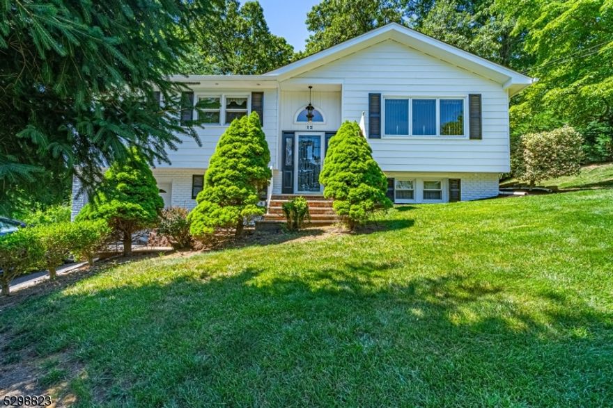 A beautiful home awaits you in Beacon Hill! Offering almost 2,000 sqft of living space & an absolutely perfect floorplan. Living room full of light opens to the dining room with high, vaulted ceiling. Lovely kitchen features superb granite counters, gourmet SS appliances, excellent cabinet space & a center island with seating. Gorgeous tile and hardwood flooring throughout. Stunning OPEN & bright layout. Upstairs offers a primary suite with access to the updated bath. 2 addtl bdrms compl this floor. Ground level boasts a family room with cozy brick fireplace, laundry, office & walkout to side yard. 4th bedroom and 2nd full bath with stall shower. TONS of storage in attic, closets, shed plus the 1 car garage. A Private, Park-Like Property, stone walls and an abundance of outdoor living spaces. Oversized deck with pergola and lawn area. Walking distance from NYC-Direct train station, shopping & parks. Enjoy bustling Dwtn Denville or choose to visit historic Mt Tabor w/all its colorful homes, post office, library & LIVE events. Top schools.