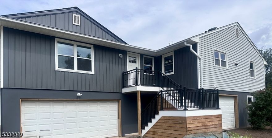 New construction! NEW NEW NEW! New electric, plumbing, HVAC, framing, kitchen, bathrooms, floors. Massive 4 bedroom 3 full bath home just raised and renovated. on a corner lot! Features HUGE garage, as well as bottom floor with abundant amounts of possibilities. Brand new kitchen with huge center island. Gas hookup behind current stove. Gorgeous backsplash and quartz countertops. All bedroom sizes are very generous. 2 bedrooms share a brand new ensuite bathroom. Common area bathroom is gorgeous. Step into the brand new primary bedroom, featuring a HUGE ensuite bathroom as well as oversized closet. Bathroom features both a separate tub as well as shower stall. Tankless water heater. Beneath the outside stairs is storage for your trash/recycling. Spacious yard! Convenient to downtown Manville. Convenient to Rt. 22, 287, and 78. Nearby Rutgers University/Robert Wood Johnson. Bridgewater/Somerville train stations also nearby.