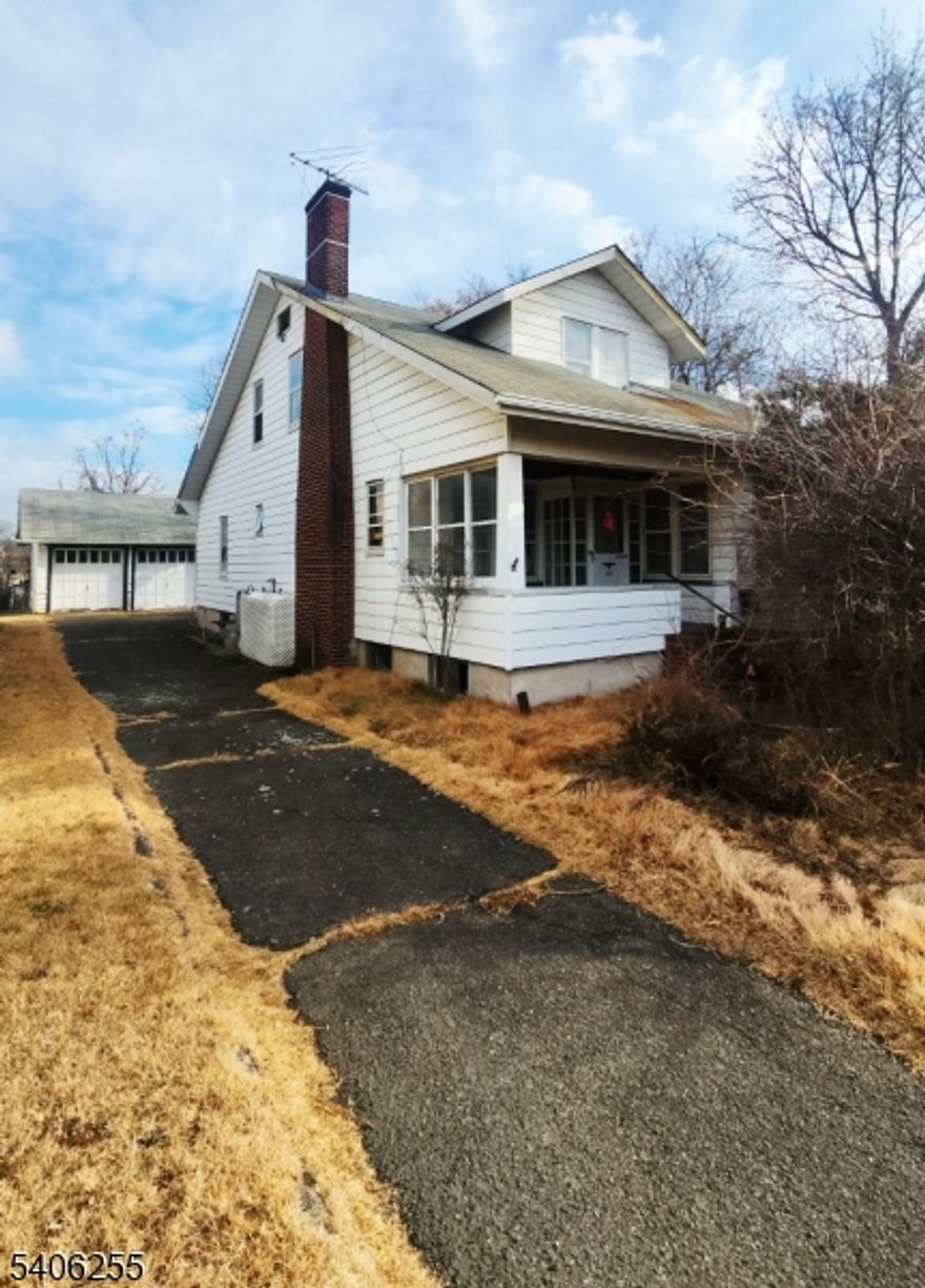 Incredible opportunity featuring a large home on an over-sized lot with massive potential.  This 5 bedroom, 2 bath craftsman can be re-imagined to the new owners wishes, expanded, or replaced with a new 1 or possibly 2 family residence. The 9,000+ square foot, flat lot offers privacy with mature hedges fronting West Broadway, a detached 2 car garage with storage loft, and a spacious side and rear yard.  Although the home is not currently habitable or functional and will not be suitable for conventional financing, this is a wonderful opportunity for a cash/rehab loan buyer with vision.