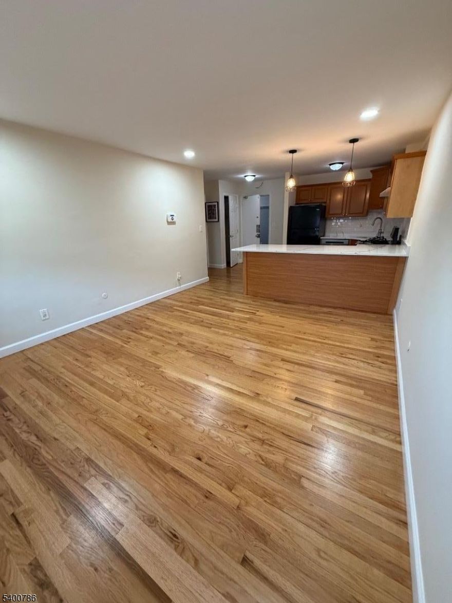 This inviting third-floor 1-bedroom, 1-bathroom apartment offers comfort, and convenience.. Enjoy a clean, updated kitchen with modern touches, including quartz-style counters, pendant lighting, and refreshed finishes and a spacious and revamped bathroom designed for everyday ease. The building features on-site common-area laundry and includes one dedicated parking space for added convenience. Located just steps from W. Grand St.'s shops, supermarkets, restaurants, and transit options, this home provides easy access to everything the neighborhood has to offer. Commuters will appreciate quick connections to major roadways, while those who love city living will enjoy being close to local amenities, entertainment, and everyday essentials.A great opportunity for anyone seeking a clean, well-maintained home in a highly accessible location.