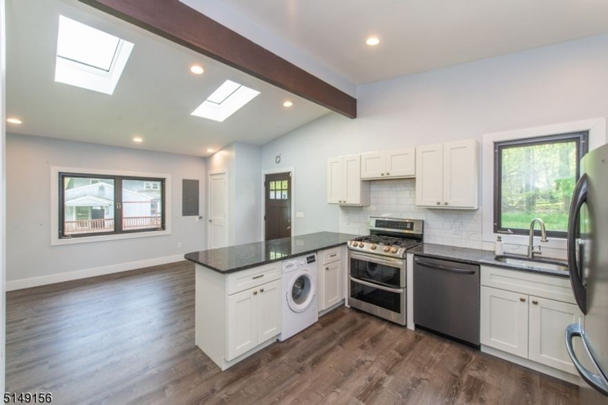 2 bedroom cottage renovated and ready for occupancy- IT IS NOT an approved rental.  Live in the cottage while renovating the main house. Cottage has been completely renovated with new luxury vinyl flooring, white shaker cabinets, granite counter tops and stainless steel appliances in kitchen, new siding and windows, updated bath with subway tile shower, central air, natural gas heat and public sewer. Main house in need of COMPLETE rehab, inside and out, it is NOT habitable in its current condition. 2 homes and 2 car detached garage are all approved structures on the lot.