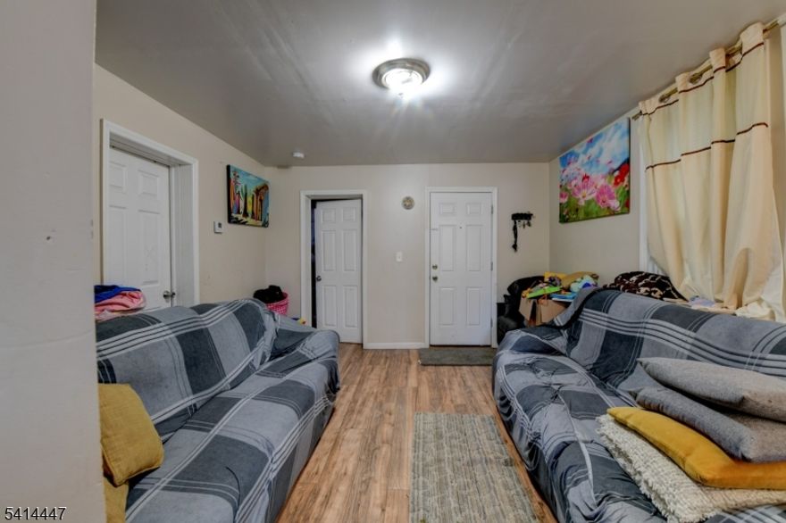 Two Unit Home in Newark's Highly Desirable Ironbound   Exceptional investment or owner-occupant opportunity! This spacious two-unit residence offers a total of 8 bedrooms and 4 full bathrooms, with a kitchen and a living room in each unit. Both units feature generous room layouts, abundant natural light finished basement.