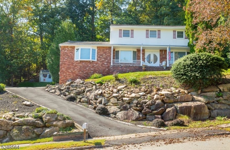 LOCATION, LOCATION, LOCATION!  RANKED AMONG THE BEST MOST CENTRALLY LOCATED TOWNS TO LIVE IN, IN MORRIS COUNTY!  Located in one of the most desirable neighborhoods, envision yourself coming home to this one-of-a-kind, spacious 4 bedroom, 2.5 bath Colonial with a Great Room that is jaw-dropping!  Drive up to your private, serene house with incredible curb appeal and idyllic landscaping.  Enter through the custom double front door with glass panels into the bright and open foyer.  This home features a Family Room with a full-width, floor-to-ceiling, brick fireplace with a raised brick hearth.  Enjoy endless days in the bonus Great Room with enormous amounts of natural radiant sunlight making this room seem even larger than it already is; Ideal for relaxation and all your entertaining needs! The eat-in Kitchen features extensive cabinet space along with several windows overlooking the custom built paver patio, extensive backyard ground space AND the hot tub perfect for four seasons of an escape from reality!  As you walk up the wide staircase to the second floor, you will find 4 spacious bedrooms and 2 full bathrooms on this level.  This ideal location makes mornings a breeze if you commute Routes 287, 80 and 46 all just minutes away.  The tranquility and beauty of the backyard and patio area create the ideal ambiance for gatherings and relaxation.  This home truly is a MUST SEE!!!