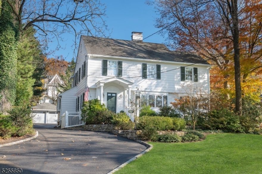 LOCATION!!! This well maintained Northside Colonial is set on .33 acres just blocks to downtown Summit with shopping, restaurants and NJ Midtown Direct train service to NYC. Updated kitchen with high-end stainless steel appliances, quartz counters, breakfast area and custom pantry. Adjacent family room with a gas fireplace, formal dining room & office w/custom built-ins. Sunny formal living room has a wood burning fireplace. Mud room opens to covered back entry, patio and yard framed by stone walls & fencing. There are four bedrooms on the second floor, including a primary suite w/ bath, oversized frameless shower, marble countertops/floor & plantation shutters. Three additional bedrooms (two with a Jack & Jill bath). Two car detached garage. Chimneys, fireplaces and flues being sold in "as is " condition with no known defects.