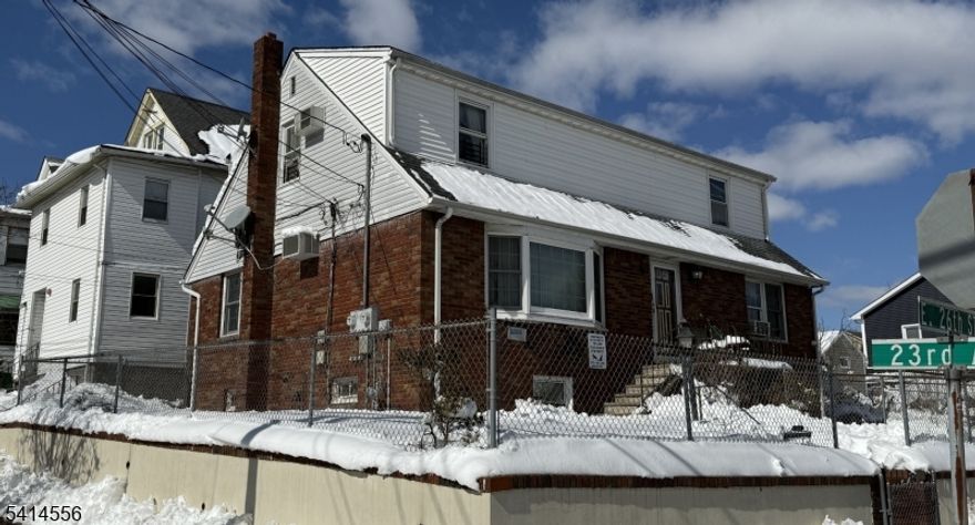 Well-maintained two-family property offering two residential units plus a full finished walk-out basement providing additional living or recreational space. The property features a total of four bedrooms across the units with functional layouts and separate living areas. Conveniently located near Peoples Park with easy access to major highways and mass transit. Ideal for owner-occupants or investors.