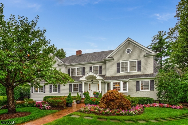 STUNNING 6BR, 5 1/2BA colonial sits on beautifully landscaped grounds located on a tree-lined street in the "Hill Section" of town.  This completely renovated designer home has it all. 1st Fl:Gourmet kitchen w/large island & quartzite countertops that opens to a spacious family rm w/fireplace & wet bar. DR, LR w/fireplace, Sunroom, Mudroom/Pantry w/heated floors&built-ins. 2nd fl:Master w/sitting area, gas fireplace, walk-in closet & gorgeous bath w/heated, marble floors. 3 addt'l BR's and 2 addt'l BA's complete the 2nd floor.  3rd fl: 2BR's, 1BA, cedar closet & attic access.  Finished basement w/wine room, tasting room, wine wall, laundry rm, full BA, storage. Backyard has paver patio w/gas firepit, built-in gas grill. Full house generator, new windows. See features sheet for details.