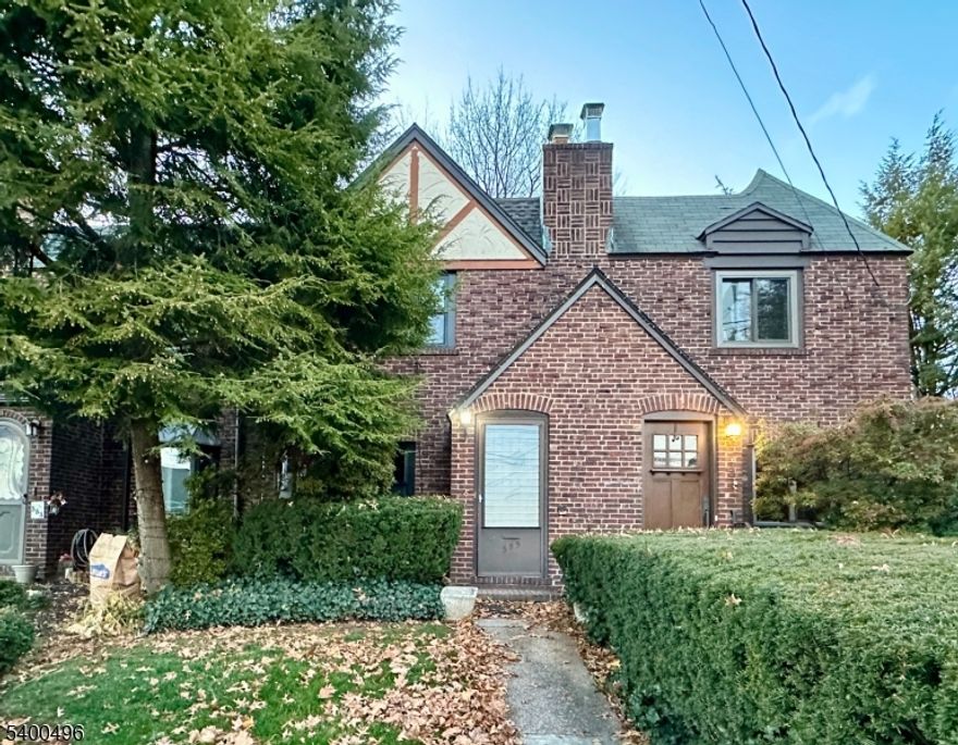 Welcome to 355 Valley Blvd, a beautifully renovated Tudor-style row house that blends classic character with modern design. This two-bedroom, one-bath home has been completely updated throughout with new appliances, fixtures, and finishes. The main level includes a welcoming living room, formal dining area, and a stylish new kitchen that opens to a comfortable family room overlooking the fenced backyard. Upstairs are two well-proportioned bedrooms and an updated full bath. The lower level offers laundry and storage space, and there is a detached one-car garage. Located in a desirable neighborhood close to shops, dining, and major commuter routes, with a NYC bus stop right on the corner. Move-in ready and thoughtfully renovated for today's lifestyle.