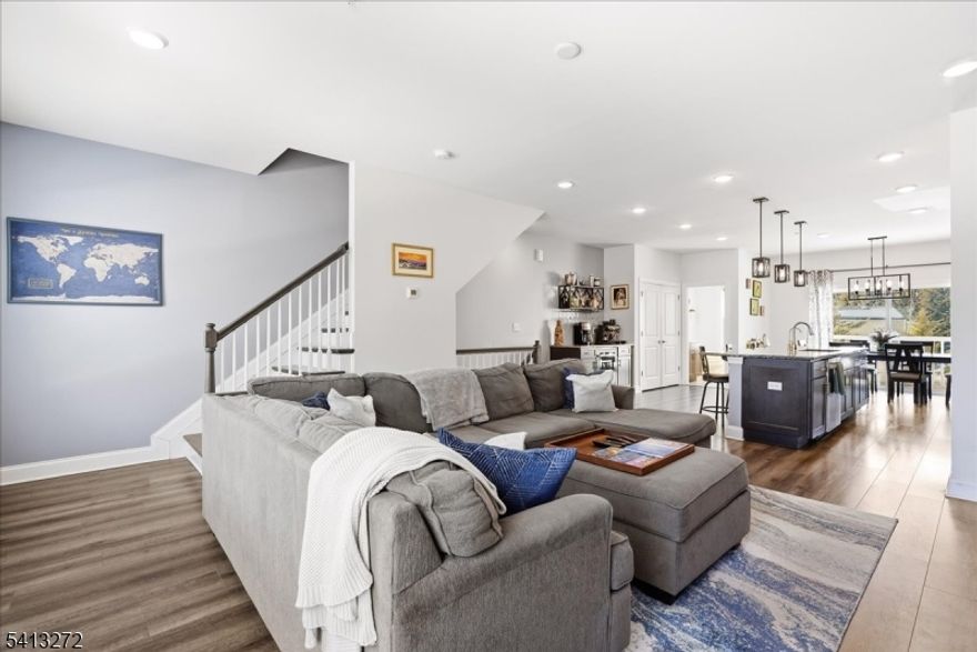 Forget the snow shovel and enjoy truly low-maintenance living at 905 Abbe Rd., where the HOA handles snow removal for driveways and walkways, plus landscaping and common area maintenance. This brick-front townhouse offers 3 bedrooms and 3.5 baths across three finished levels in one of Little Falls' most desirable communities.The ground level features an attached garage, full bath, and a flexible bedroom ideal for guests, a home office, or gym. Step outside to the patio perfect for grilling, entertaining, or relaxing on a quiet evening.The main living level showcases a bright, open-concept layout connecting the family room, dining area, and kitchen. Granite countertops, abundant cabinetry, a pantry, and a large center island, equipped with a reverse osmosis water filtration system, anchor the space. A dedicated coffee bar with built-in wine fridge adds a touch of luxury, while the dining room balcony offers the perfect spot for morning coffee or an evening glass of wine.Upstairs, the spacious primary suite features a custom walk-in closet, private balcony, and en-suite bath with double vanity. A second well-sized bedroom, full bath, and convenient laundry complete the top floor.Minutes to the train, NYC buses, major highways, and a vibrant Main Street filled with restaurants, farmers' markets, parades, and community events, this home delivers comfort, convenience, and effortless Ownership year-round. 905 Abbe Rd. is a must see!