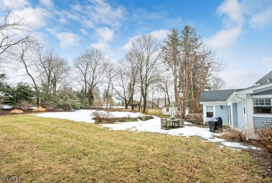 The perfect blend of classic charm and modern comfort. This beautiful 4-bedroom center hall Colonial sits on a level half-acre lot just moments from downtown Basking Ridge and Oak Street School. Inside, warm hardwood floors, spacious living areas, and abundant natural light create an inviting atmosphere throughout. The updated kitchen with marble backsplash and center island opens to a relaxed dining space and cozy family room ideal for everyday living and entertaining. A private office en-suite provides the perfect work-from-home retreat, while the partially finished basement offers flexible space for recreation fitness, or play and a cedar closet.  With a heated garage, new roof (2025), full house generator, primary suite and family room bulit-in sound system and a wonderful backyard setting this home offers both comfort and convenience in a sought-after neighborhood.