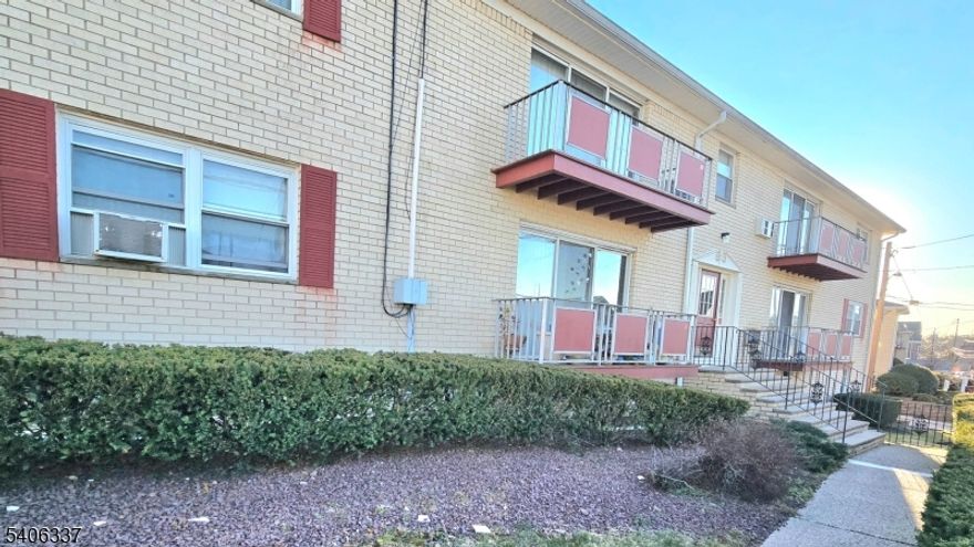 Updated and Move-in Ready First Floor Unit! Beautifully Updated Eat-in Kitchen and Bathroom! Nice Hardwood Floors! Custom Stone Wall in Dining Room. Balcony off Living Room.