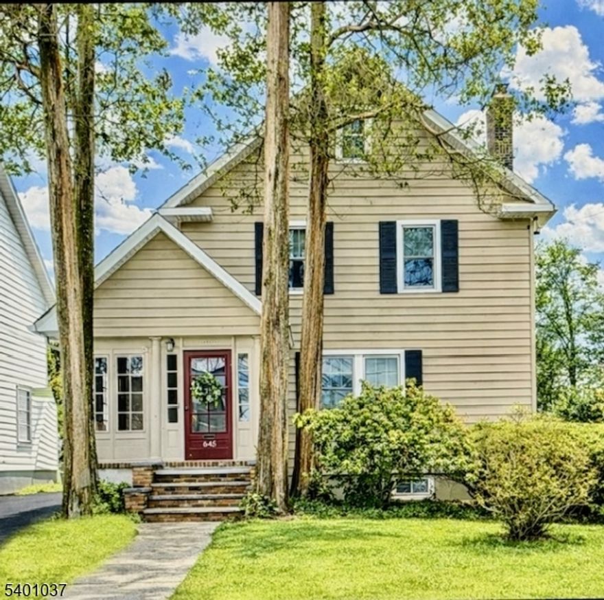 Welcome to this meticulously maintained 3 bedroom, 2 full bath home where timeless character meets everyday comfort. An inviting three-season porch greets you at the entrance perfect for morning coffee or a relaxing evening.  Inside, the thoughtfully designed floor plan offers exceptional flow for daily living and entertaining. Original hardwood floors create an entry into an inviting living room anchored by a cozy, gas fireplace. The wood flooring guides you into the formal dining room, creating a warm and elegant setting for gatherings. Continue through to a spacious sun-drenched family room overlooking the beautiful backyard with a perennial pollinator garden. A full bath and eat-in kitchen round out the features for the first floor. Upstairs 3 comfortable bedrooms, also featuring hardwood floors, are restful retreats with a dressing area attached to the full bathroom. Additional highlights to this home include an unfinished attic for storage and semi-finished basement perfect for recreation, hobbies, or workout space. The fenced-in backyard bursts with seasonal blooms for a private retreat while a detached garage adds everyday practicality. Ideally located near community pool, parks, and an award-winning downtown, this home also offers easy walking access to New York City trains and buses, making commuting seamless while enjoying the best of suburban living.