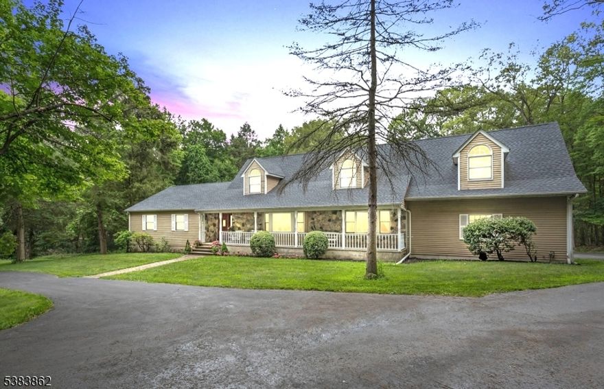 Welcome to a truly special retreat, set on 2.6 stunning acres and backing to a Nature Preserve, offering a level of privacy and serenity that is increasingly rare. At the heart of the home is a spectacular, light-filled kitchen designed to inspire. Soaring ceilings, expansive walls of glass, and skylights flood the space with natural light . It?s a kitchen that stops you in your tracks and  becomes the gathering place for all.The home is impressively sized and thoughtfully designed to accommodate even the largest gatherings with ease. It offers incredible flexibility?perfectly suited as a five-bedroom home with two private offices, or expanded to a seven-bedroom layout ideal for large living. Multiple living areas create both togetherness and quiet retreats.Car enthusiasts, hobbyists, or those dreaming of a workshop will appreciate the 4?6 tandem car garage, offering space rarely found and endless possibilities. Whether for collections, projects, or storage, this space truly elevates the property. For many the "shop" is the favorite place in the home. Every corner of this home feels warm, welcoming, and thoughtfully crafted, yet its scale and setting make it unlike anything else. Surrounded by nature, exceptionally private, and filled with light, this is a home that invites you to slow down, spread out, and create lasting memories. A rare offering where beauty, space, and privacy come together in perfect harmony.