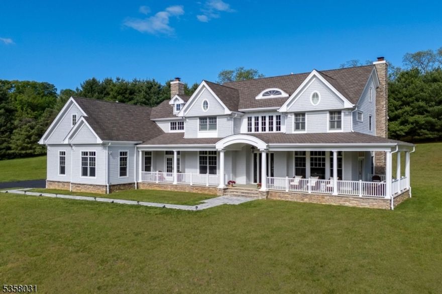 Exquisitely designed and masterfully crafted, this custom estate is perfectly nestled on 2.19 private acres in a peaceful cul-de-sac. Home offers over 5000 sq ft of living space & grand doorways with transom detailing, soaring 10 ft ceilings & expansive windows fill the home with natural light & timeless elegance. Featuring 5 spacious bedrooms, 3.1 luxurious baths, a handsome home office/bedroom & rich hardwood floors throughout. The gourmet kitchen impresses with stainless steel appliances, custom cabinetry, & refined finishes. Marble vanities, custom closets, and a sprawling basement with high ceilings offer both comfort & function. A generous bonus/flex space above the garage provides endless possibilities. Bluestone wrap around front porch & patio complete this extraordinary home.Home boasts oversized 3 car garage, and cement stair entry to basement. Centrally located with a quick commute to NYC via ferry/bus, close to major shopping and restaurants! Call today for a private showing!