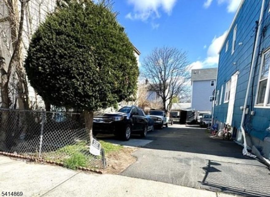 Rare investment opportunity! 25x99 vacant lot generating approx. $750/month from parking while you plan your two-family build. Survey available confirming development potential. Collect income now and build later ideal for builders, investors, or end users seeking future value.