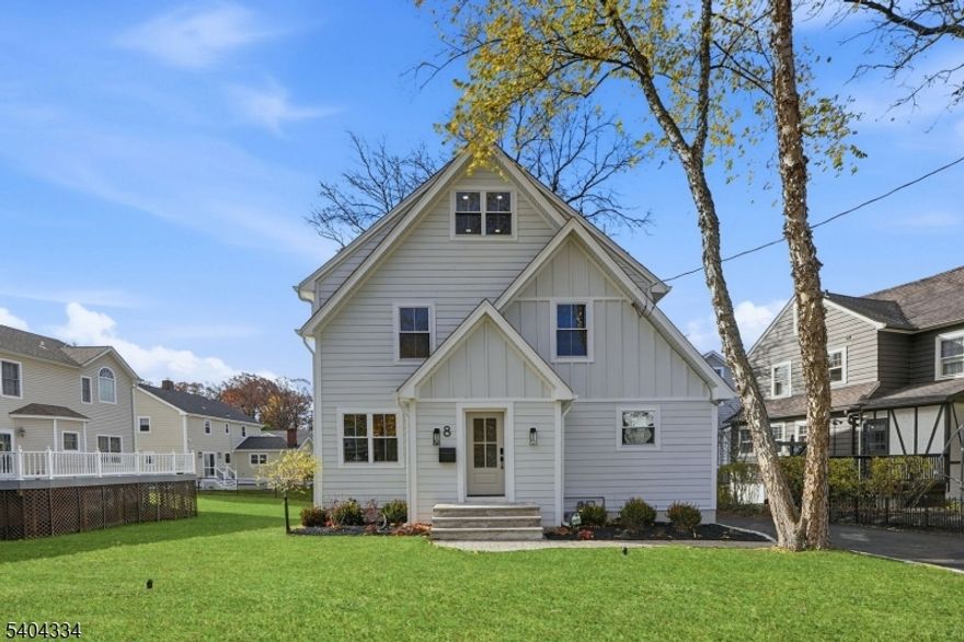 Reintroduced at a compelling value, this fully renovated Millburn home invites you into 3,700 sq ft of beautifully curated turnkey living, where designer finishes, effortless flow, and proximity to top-ranked schools create the perfect setting for family life. Welcome to 8 Mountainview Rd, a thoughtfully reimagined luxury residence spanning four levels with 5 bedrooms and 4.5 bathrooms. Sunlight streams through large windows and 8' sliding glass doors, illuminating the open-concept layout ideal for gatherings. Move-in ready, the home features new James Hardie siding, roof, windows, multi-level PVC deck, and sodded lawns. The stunning kitchen offers quartz counters, solid wood soft-close cabinets, 36" range, and oversized island. Bathrooms are fully redesigned with premium tile, custom showers, and a freestanding tub in the primary suite. Additional upgrades include new oak floors, updated lighting, fresh paint, a first-floor flex/office, upper-level laundry with new Whirlpool washer/dryer, and a finished basement with full bath. Steps from Millburn town and parks, this home combines convenience, elegance, and comfort, an exceptional opportunity to make it yours.