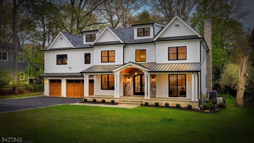 Welcome to this exceptional center hall colonial where timeless design meets modern luxury, set on a rare 1-acre level lot. A grand foyer with herringbone floors & statement chandelier is flanked by a formal dining room w/ coffered ceiling, wine display & butler's pantry, and a warm living room w/ wood-planked ceiling & sliders to the front porch. The heart of the home opens to a stunning family room w/ fireplace and a chef's kitchen featuring a large quartz island, Sub-Zero refrigerator, dual Cove dishwashers, Fisher & Paykel induction range, and extensive custom cabinetry including a walk-in pantry & floor-to-ceiling storage. A mudroom w/ built-ins connects to the 3-car heated garage w/ EV charging. A private 1st-floor guest suite w/ full bath & sauna offers a perfect retreat. Walls of sliders lead to a covered patio w/ wood ceiling, heaters, built-in grill & stone fireplace, overlooking a beautifully landscaped, fenced, park-like yard w/ bluestone patio & hot tub hookups. The 2nd floor features all ensuite bedrooms w/ custom closets, laundry room, and a luxurious primary suite w/ fireplace, vaulted ceilings, coffee bar, beverage fridge, dual walk-in closets & spa bath. Finished 3rd floor w/ powder room. Lower level includes rec space, gym, wine room, kitchenette & hidden vault. Heated floors & whole-house water filtration add comfort & efficiency. Near Top-rated Chatham schools, vibrant downtown & NYC train. 7 BR, 7 full & 2 half baths built by Little Bear luxury builders.