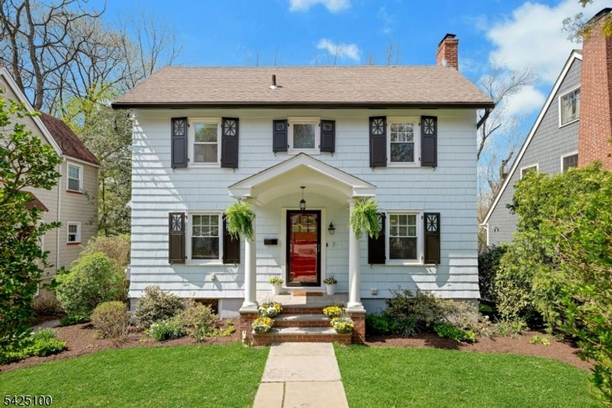 Welcome Home to this charming Colonial, perfectly nestled on a quiet, tree lined cul-de-sac. Combining classic charm with modern amenities, this home is just a short stroll to the vibrant Maplewood Village, local parks and NYC direct train. The journey begins on the welcoming covered front porch, an ideal spot for morning coffee while enjoying the serene gardens. Inside, the inviting living room is bathed in natural light and and anchored by a wood burning fireplace with custom built-ins. A wide entry leads you effortlessly into the spacious dining room, creating a seamless flow for hosting. The kitchen boasts recently refinished crisp white cabinetry, stainless appl and direct access to the outdoor oasis! Tucked away is the versatile "Maplewood Room" is the perfect sun drenched sanctuary for a home office or cozy den. The 2nd fl features 3  spacious bedrooms. The primary bedroom is a true stand out, boasting a custom designed dressing area with integrated closet/cabinetry. This level is completed by a updated hall bath and easy access to the large attic. The lower level offers the ultimate in flexibility with a rec room, dedicated exercise room and a full bath.The laundry room is a powerhouse of efficiency, equipped with 2 washers/1 dryer.. Step outside to a spectacular private three tiered oasis designed for year round enjoyment. Whether you are hosting summer BBQS on the patios or unwinding in the sunken hot tub, this private retreat offers suburban living at its best!