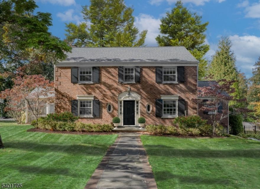 First impressions are everything with this beautifully maintained 4-bedroom, 2.5-bath Colonial, perfectly situated on a desirable lot in one of Summit's most sought-after neighborhoods. With loads of curb appeal and timeless character, this home is what you've been looking for. Inside, a bright and inviting floor plan showcases beautiful hardwood floors throughout, abundant natural light, and effortless flow from room to room. The first floor is complemented by a large butler's pantry area, offering endless possibilities whether you envision a coffee bar, prep space, home office nook, or stylish storage solution. Expansive LR/DR combination, ideal for entertaining and daily life, with a great flow and natural light throughout. Extend your living space outdoors with a beautiful deck perfect for entertaining, dining al fresco, or soaking up the sunshine. A screened-in porch adds another inviting spot to unwind on warm spring and summer evenings. All four bedrooms are conveniently located on the second floor, including a spacious primary suite with its own private bath. The walkout basement features a large recreation area along with ample storage, providing flexible space for work, play, or relaxation. Enjoy the ease of everyday living with direct access from the two-car garage.Meticulously cared for and well loved, this home is ready for its next chapter. A special opportunity to own a classic Summit Colonial where new owners can create lasting memories for years to come.