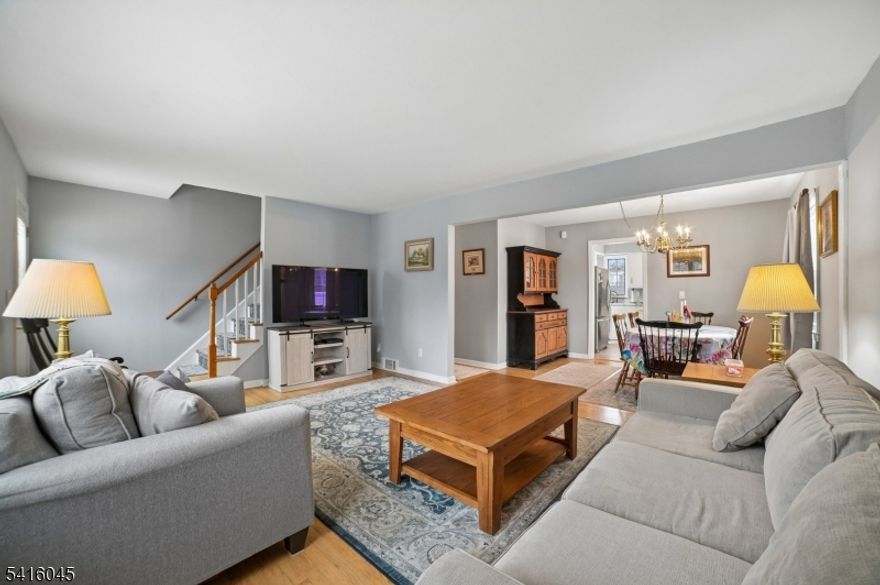 Charming Cape Cod set on a double-sized corner lot in the heart of Fanwood, offering timeless character, bright living spaces, and exceptional pride of ownership. The sun-filled living room with large picture window flows effortlessly into the dining area, creating a welcoming setting for both everyday living and entertaining. Hardwood floors add warmth and character throughout the main level.The kitchen features stainless steel appliances, generous cabinetry, and a comfortable breakfast area with easy access to the backyard and deck. Upstairs offers a spacious bedroom suite with flexible sitting or office space, providing a quiet retreat.The finished lower level includes a large recreation room with wood-burning stove, ideal for relaxing evenings or additional living space.Outdoor living is equally inviting with a deck, patio, above-ground pool, and expansive yard, perfect for gatherings and summer enjoyment.Lovingly maintained by the same owners since 1983, the home is truly immaculate and move-in ready.Located within a Blue Ribbon school district and just a short walk to downtown Fanwood, shops, restaurants, and NJ Transit trains to New York City.