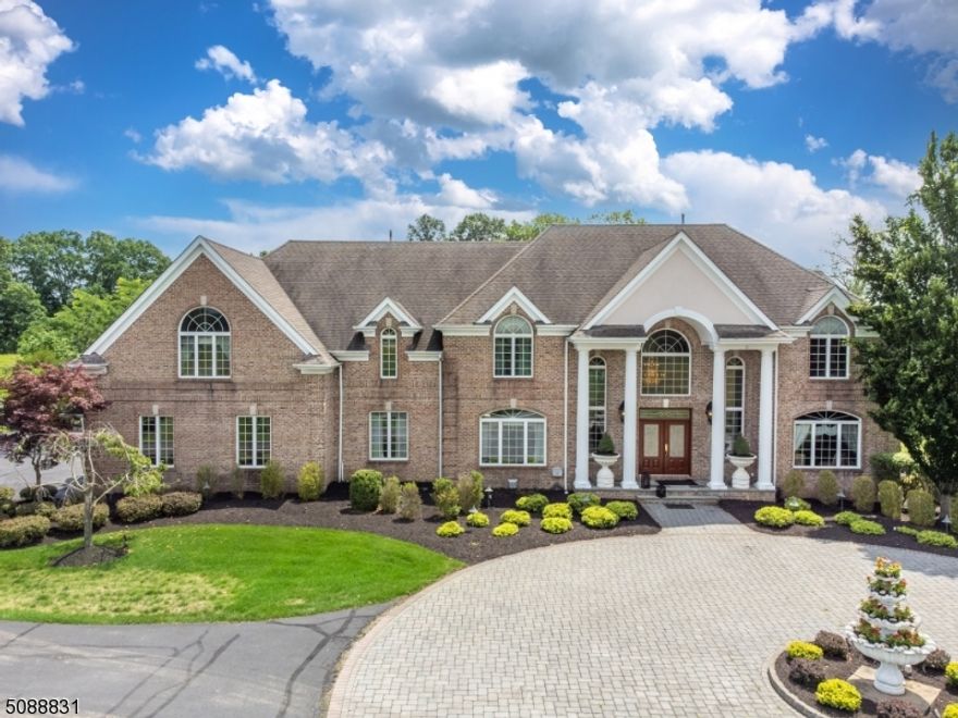 Exceptional Private Country Retreat on 12+ Level Acres. Gated entry and a tree lined driveway lead you to this Majestic Colonial. Entire property is fenced-in ! 6097 Sq Ft plus a superb finished basement. Brick front w/Columns and a grand foyer w/a Butterfly Staircase. A chefs kitchen w/center island & a breakfast bar ! Spectacular Eat-in-Area w/volume ceilings and a gas fireplace. Great room has soaring ceilings & a Wood burning F.P. 1st floor Bedroom & Full bath. Master suite w/high ceilings, sitting area w/balcony, double sided F.P., large master bath and walk-in-closet w/built-ins. 3 Additional bedrooms w/high ceilings and attached full baths. Luxurious walkout Lower Level has an office, Gorgeous wet bar, Movie theatre, Bedroom + Full bath & More. Stunning Backyard offers an oversized pool, waterfall, Pond, Outdoor Kitchen. New Features in this home include 3 New Bathrooms, New Full House Gas Generator, Less than 2 years old 4 units of heating & cooling, New Driveway, New roof on the outdoor kitchen. A Must See !!