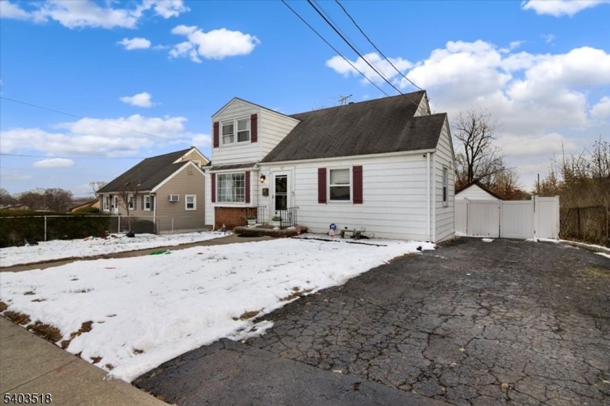 Welcome home to this elegant and inviting residence nestled in the desirable Maple Valley section of Clifton. This beautifully maintained home offers 4 spacious bedrooms and 2 full bathrooms, featuring an updated kitchen, central air conditioning, and a charming wood-burning stove that adds warmth and character.The home also includes a finished basement with convenient access from the backyard, ideal for additional living or entertaining space. Outdoors, enjoy a long private driveway leading to a detached garage, along with a fenced backyard perfect for refined outdoor entertaining, complete with an above-ground pool to enjoy during the summer months.Conveniently located near NYC transportation, shopping, malls, supermarkets, parks, schools, and houses of worship.Schedule your private showing this is a must-see home, not a drive-by.