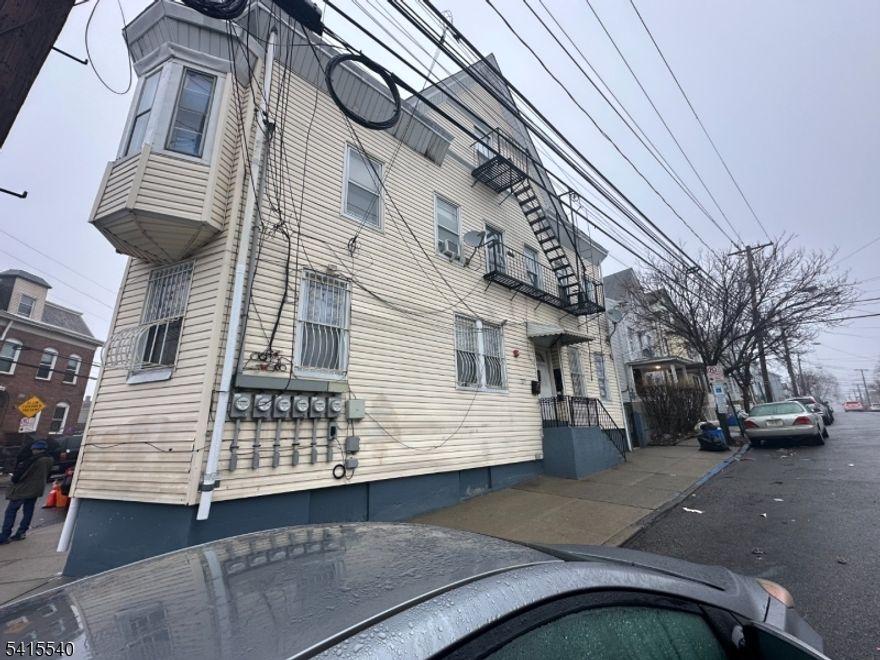 5-unit corner property with strong income potential. Unit mix includes a 2BR/1BA owner occupied unit, two 1BR/1BA units renting for $1,300 and $1,258, a 2BR/1BA at $1,040, and a 4BR/1BA unit rented for $1,800 with lease through June 2026. All other tenants are month-to-month. Laundry space with coin operated machines in the basement. A large double garage with additional second-level storage space. Up to date Green Card. and Strictly sold as-is. Great opportunity for investors, a must-see income property with serious potential.