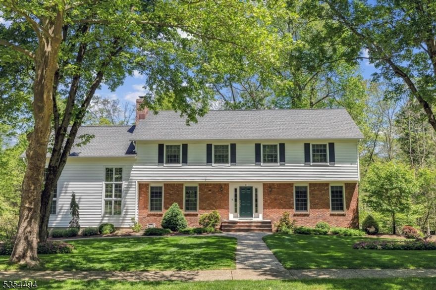 Tranquil setting bordered by Stony Brook in the rear (not a flood area) creates a peaceful atmosphere on the deck or patio!  Tremendous curb appeal with flowering trees and perennials welcomes you to this impeccably maintained colonial in Warwick Estates with miles of sidewalks!  Foyer has 2 guest closets, formal front to back living room with hardwood flooring, formal dining room with tray ceiling detail, very large eat-in kitchen with wood burning fireplace, center island, granite countertops and stainless appliances.  2 story family room with loft above and wood burning fireplace, sliders to deck, powder room and laundry room complete the first floor.  Bedroom level features primary suite with walk-in closet and loft, full bath with jetted tub and large stall shower, as well as double vanity.  Walk-out unfinished basement has limitless possibilities for finishing with high ceilings and leads to brick patio.  Other highlights include 2 car wide freshly paved driveway, skylights for additional natural light, public sewer and water, natural gas, Andersen thermal pane windows and generator hookup, generator included.  Part of desirable Cucinella school district and West Morris Central High School with IB Program.