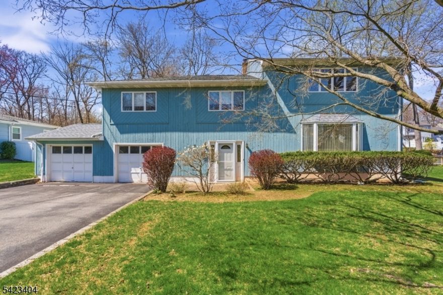 This 4 bed, 2 full and 2 half bath home has been meticulously maintained and is ready for move-in or your design updates. This house is located in the highly sought after Parsippany school district with a Morris Plains mailing address. The outside of the property includes a paver patio and, a large partially fenced flat backyard perfect for hosting parties. The entry from the 2-car garage or front door leads to the family room with a half bath, laundry area, wood-burning fireplace and direct access to the backyard. A few steps up is the main living level featuring an eat-in kitchen with a garden window, ample cabinetry, and stainless steel appliances. The formal dining room flows seamlessly into both the living room and a sun-filled sunroom offering a skylight, wraparound windows, French doors, and sliders to the patio. The next level offers 3 bedrooms and a full guest bath. Bedroom 2 features a half bath and walk-in closet, while bedrooms 3 and 4 have large picture windows. The expansive primary suite includes a skylight, picture windows on two walls, a walk-in closet, and private full bath with skylight. An unfinished basement provides excellent storage or future living space. Easy access to Routes 80, 10, and 287.