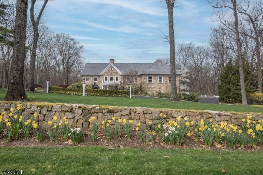 Thoughtfully updated custom home with a remarkable view overlooking the Bernardsville mountain.  Built of Delaware stone and wood siding, a new cedar roof with copper gutters & down spouts as well as copper covered dormers were installed in 2023. A new driveway was installed in 2023. With 5 bedrooms and 5.3 baths, newly updated kitchen with massive Canadian Walnut island and top of the line Viking and subzero appliances.  The primary offers an Anne Sacks marble bathroom with soaking tub and a gorgeous tadelact plaster shower with linear floor drain. White Azek by Walpole fencing  surround the property. Finished basement, complete with gaming room and gym round out this move in ready home. Billiard Table and bench stays and all gym equipment except Pro Ski Machine, TV's are staying in the Family , Billiard and Gym rms. Basement ceiling projector/equipment is include as well.