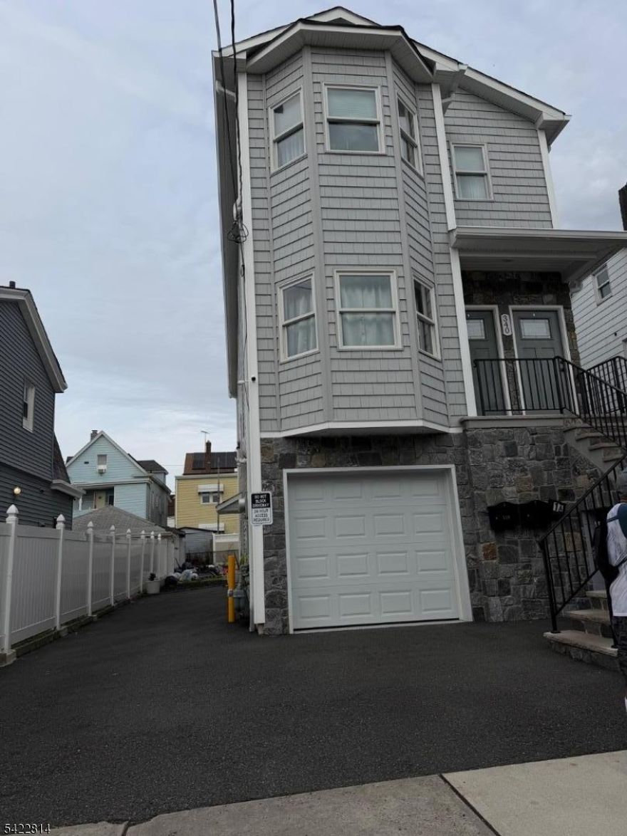 BEAUTIFUL TWO FAMILY HOME, 3 YEARS OLD, OFFERING OPEN CONCEPT, 3 BEDS, TWO BATHS ON EACH FLOOR, LAUNDRY ROOM, ONE CAR GARAGE, EXTRA PARKING FOR UP TO 4 CARS. CENTRAL HEAT & A/C. LAUNDRY ROOM, FINISHED BASEMENT & MUCH MORE.