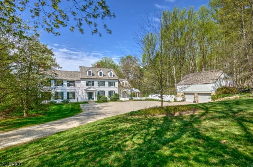 This wonderful 4 bedroom Custom colonial home sits at the end of a long private drive on over 13 plus prime acres of open fields and mature woodlands.  Antique details, beams and stonework.  Views highlight nearly every room-overlooking grounds with flowering perennial gardens, patios, and a heated pool.  An open foyer that leads to the dining room and great room. Country kitchen opens to the family room with a wood burning fireplace and access to the patios and pool. A wonderful study with fine millwork, cabinetry, and fireplace.  The great room has oversized  windows, French doors and a beautiful stone fireplace. A spacious screened in porch off of the kitchen with vintage herringbone brick floor room enough for dining and entertaining and overlooks the property.  The master bedroom suite has a large walk-in closet, three walls of windows, a wonderful masonry gas fireplace, private balcony and large bathroom with radiant floors. Three more bedrooms on this level with wood floors or new carpeting. The walk out lower level includes a great area for an entertainment room, laundry area, large bathroom, workshop, and a unique temperature-controlled wine cellar.  5 Fireplaces, New windows and doors on the Ist level, New cedar shingle roof, updated HVAC, Generator, update electric, new gutters, new exterior painting and farm assessed Acres.