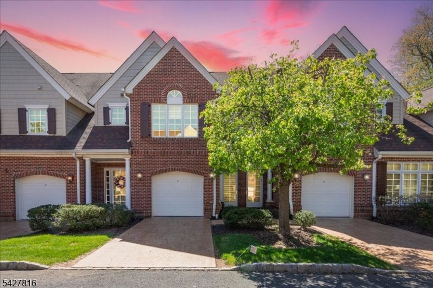 55+ community! Beautifully updated townhouse offering a blend of thoughtful design, quality finishes, and everyday convenience, including a private elevator. The custom kitchen features ceiling-height cherry cabinetry, generous storage, and a bright eat-in area. The large living room includes a gas fireplace and an open layout ideal for a variety of uses. The primary suite offers two walk-in closets and an updated en-suite bath with refined finishes. A second bedroom is located near a full bath and includes a double closet, providing flexible space for guests, work, or other needs. Wood flooring, detailed finishes and custom carpeting are found throughout the home. Enjoy private views of mature landscaping, creating a peaceful setting year-round. A covered deck accessed from the living room provides an inviting outdoor space. Situated in a well-maintained community near Watchung Lake, residents can enjoy nearby walking paths and scenic surroundings. Conveniently located close to shopping, dining, and major roadways, this home offers comfort, style, and accessibility in a desirable setting.