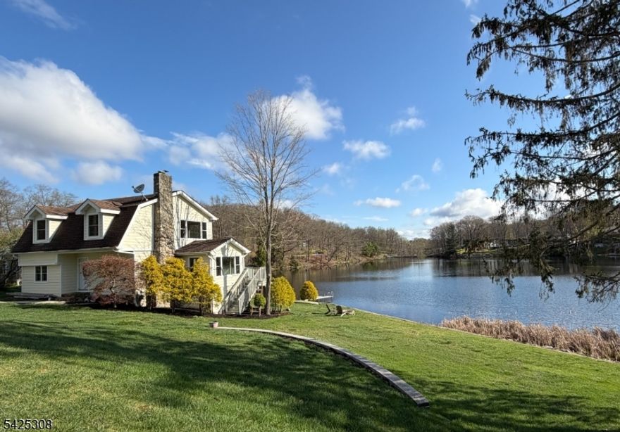 Beautiful lakefront home on a double lot located on a quiet cul de sac. Welcome home to this beautifully maintained 3-bedroom, 2-bath raised ranch, perfectly situated on stunning park-like lakefront property. Nestled among mature trees, Step inside to discover a bright and inviting layout featuring spacious living areas, large windows that fill the home with natural light, and seamless indoor-outdoor flow.The country style kitchen opens to both the dining/living room area, ideal for both everyday living and entertaining.Outside enjoy your own private piece of paradise on Lake Saginaw with a dock for kayaking the serene, quiet lake.This is a great opportunity to become a lakefront homeowner on a quiet lake-no motor boats- in NJ!The entire house was extensively renovated down to the bare studs in 2012, new electrical, plumbing, kitchen, baths, floors, A/C, exterior, roof & deck. Boiler was replaced in 2023. New septic is going to be installed soon.