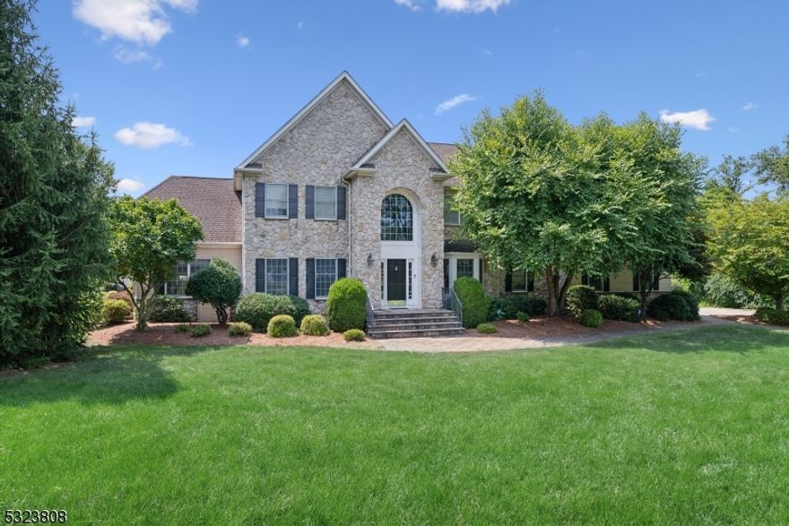 Spacious Sophistication & Tranquil Privacy. Gorgeous Colonial on over 2 acres set mid-block in a bucolic residential cul-de-sac neighborhood, yet close to shopping, dining, highways and more in downtown Chester. Inviting 2-story foyer ushers you into the main level highlighted by gleaming hardwood floors, crown molding and an elegant atmosphere. A cozy living room leads to a sunroom currently used as a movie/entertaining room with vaulted ceilings, built-in bar, and walls of windows. Formal dining room with bay window and tray ceiling can easily host everyone for dinner, and the gourmet kitchen is appointed with stainless appliances, center island and breakfast nook. Next is a stunning family room with vaulted ceiling and stately stone fireplace for chilly evenings, and a dedicated office is down the hall. A large laundry/mud room with garage access and a powder room complete this level. Upstairs, an oversized primary retreat has a huge bedroom, 2 walk-in closets and en-suite with jetted corner tub and separate shower. There's also a junior en suite, plus 2 more bedrooms sharing a Jack-n-Jill bath. Finished lower level offers a sprawling recreation room plus a second powder room and ample storage. An outdoor paradise awaits your summer BBQs with a generous deck with  a retractable awning, and paver patio, sparkling, fully fenced in-ground heated pool with pool house with new roof and electric, and a lush tree-lined backyard with endless space for gardening, relaxing and more.