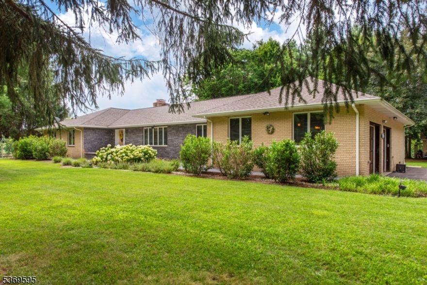 Equestrian Property with Scenic Acreage amid Blairstown's rolling landscapes. Welcome to this well-maintained farmette situated on beautiful, open land. Thoughtfully designed for equestrian use, the property features a 4- stall barn equipped with wash stall, hayloft, motion sensor lighting, and security system for added peace of mind. Your horses will enjoy plenty of space to roam with Ramm flex coated wire fencing, and there is direct access to riding ring that's well suited for jumping and schooling.  After a day outdoors, relax in the Solarium while enjoying views of private acreage. Whether you're an active rider or simply looking for a peaceful rural lifestyle, this property offers comfort, functionality and room to grow.  A rare opportunity for anyone seeking an established turnkey equestrian estate.