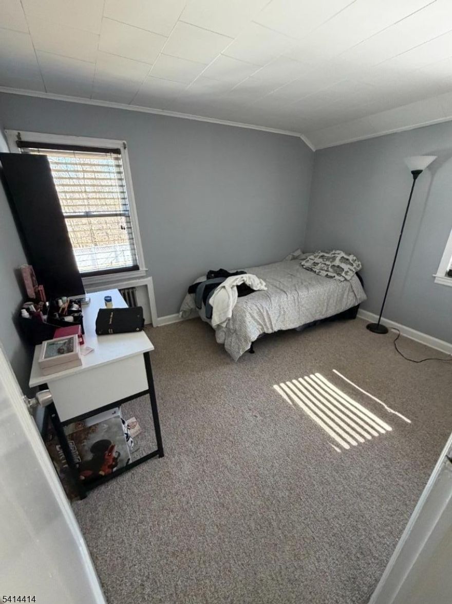 Investor Opportunity in West Orange! Fully tenant-occupied two-family property offering immediate rental income and strong long-term potential.Each unit features 2 bedrooms, living room, dining room, and gleaming hardwood floors throughout. Energy-efficient solar panels help enhance overall property value and efficiency.The finished basement with a separate entrance offers additional finished space including two rooms, a recreation area, and a full bath   providing flexibility for extended use.Private oversized backyard and convenient access to major highways, shopping, dining, and NYC transportation. A solid addition to any investment portfolio