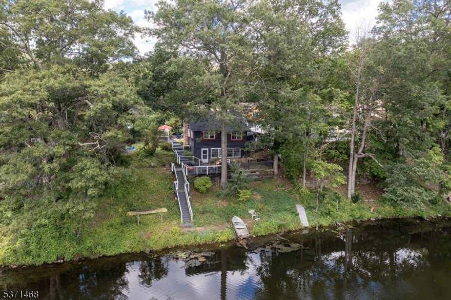 This beautifully maintained 3 bedroom, 2-bathroom home offers breathtaking views of Lake Swannanoa, with stunning sunrises and sunsets right from your doorstep. Recent upgrades include:New roof (2023),Two newly repaved driveways offering ample parking and two spacious storage sheds.Whether you're looking for a peaceful year-round residence or a weekend getaway, this property combines comfort, convenience, and natural beauty in one perfect package. Direct access to lake where you can kayak, canoe, fish and ice skate! Gas motors are not permitted, electric motors only! Other amenities include beach, playground and picnic area!