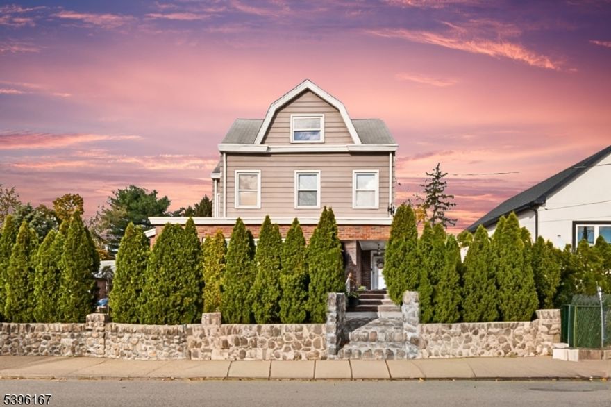 Welcome to this beautifully maintained all brick Colonial in the heart of Totowa, showcasing timeless charm blended with modern comfort. This spacious 5-bedroom, 2.5 bath home features sun filled living areas, gleaming hardwood floors, and a large kitchen ideal for gatherings. The formal dining room flows into an inviting family room perfect for relaxing or entertaining. Upstairs, generously sized bedrooms include a bright primary suite with ample closet space. A full basement, walk up attic, and detached two car garage offer added versatility. Conveniently located near Routes 46, 80, and 23, with easy access to shopping, dining, parks, top-rated schools, and the Wayne Transit Center for effortless NYC commuting.