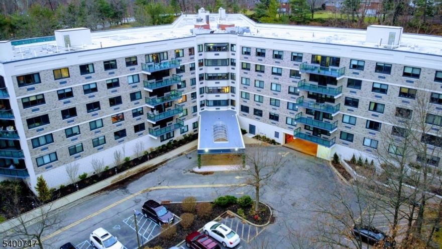 Community amenities included a heated outdoor pool, newly renovated and scheduled to open in Summer 2026, along with a scenic pool deck and an adjacent club room/gathering place. The residence offers 1065 square feet of living space, featuring a well designed layout with one full bath and one half bath, generous closet space and a spacious private balcony with wooded views, perfect for for relaxing or outdoor dining. Additional amenities include 24/7 concierge and front desk service, valet parking service for one car in an indoor garage. The club area provides a fitness center, sauna, and changing areas. There is a lobby level storage area. Recent upgrades include a refreshed hallway design and complete boiler room renovation. A weekday Jitney provides service to South Orange train station making commuting to New York very easy. Information regarding Association fee.   Association fee 1276.76 per month. Different components-$921 monthly maintenance, $228,06 Special assessment, $127.68 for electric which can vary from month  to month. Owner has appealed the tax assessment which has reduced the tax assessment and the taxes to $6500 a year approximately based on current tax rates.