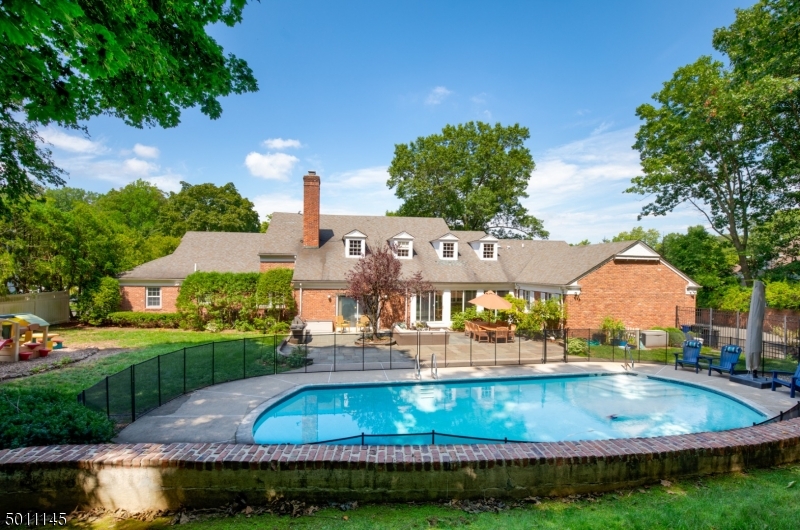 Sprawling brick expanded ranch with fabulous floor plan on .88 AC of private property in coveted Hartshorn, huge Patio & Pool complemented by a home w/incredible potential to be amazing! Elegant w/winding staircase, open & airy Liv & Din Rms, Lg Fam Rm w/fp Lg kitch adjacent to sun room, private 1st floor Guest/Au Pair suite, laundry on 1 wing, Master suite & 2 other roomy bedrooms in other wing. Massive 2nd Lvl w/5th Bed/bth & huge unfin attic. Full Bsmt that could easily accommodate Rec Rm, Exercise Rm, Bar Rm, Wine Cellar, etc. Spacious 2 car garage. Many new appliances installed in 2020. Property goes back to 2nd fence. The possibilities for this home are endless! **sold strictly as-is condition. See pre-inspection punchlist. Please conduct any inspections prior to making offer.