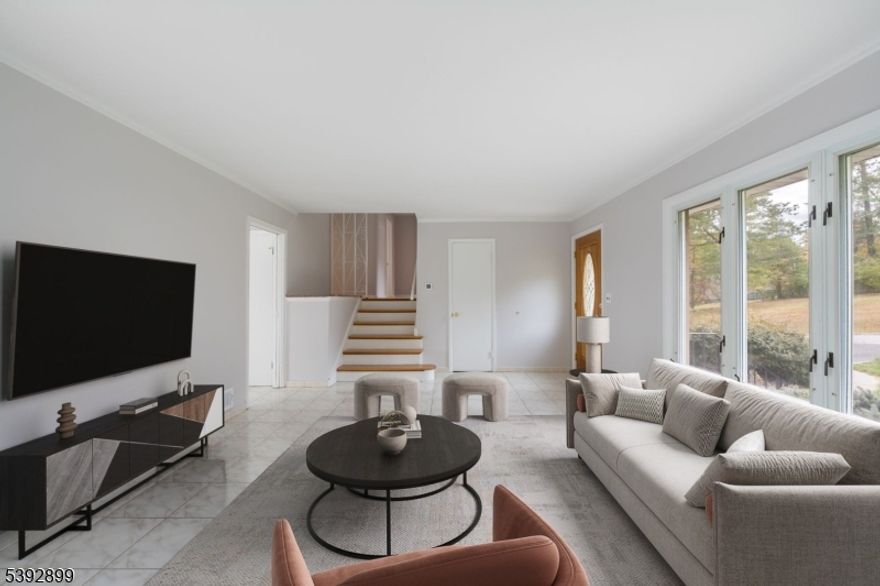 Renovated in 2025 " Stunning Split-Level Home in Desirable Mount Pleasant, West Orange! Amazing location and endless opportunities await! Beautifully renovated in 2025, this well-maintained Split-Level home is perfectly situated on a prime corner lot. Offering a blend of modern updates, spacious living, and future potential, this home is move-in ready and full of possibilities. Step inside to discover a bright, open-concept main level featuring a spacious living and dining area that seamlessly flows into a modern Eat-in Kitchen, perfect for gatherings and everyday living. The expansive deck provides sweeping views of the large, landscaped yard ideal for outdoor entertaining and relaxation.The second level offers three generously sized bedrooms, including a Primary Bedroom with a walk-in closet and private powder room. The lower level adds even more versatility with a second kitchen, bonus entertaining area, and walk-out access to a covered patio. The concrete patio, built on a full foundation, provides exciting options for future expansion or customization.Additional highlights include central air, ample off-street parking, and a full basement offering abundant storage or additional living space potential.Located just minutes from shopping, schools, Turtle Back Zoo, major highways, and NYC transportation, this home combines suburban comfort with exceptional convenience. Move-in ready, renovated in 2025, and full of potential   your dream home in West Orange awaits!