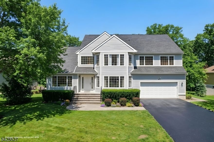 Sophistication meets flexibility in this stunning Colonial, where every detail has been thoughtfully designed for elevated living. Hardwood floors, vaulted ceilings, fantastic natural light, beautiful updates, newer roof and HWH, abundant space inside and out, and a flexible floor plan to fit changing lifestyles. Inside, a soaring two-story foyer makes an immediate statement, while French doors open to a large 5th bedroom or private home office. The formal living, dining, and family rooms flow seamlessly for easy entertaining, and an elegant gas fireplace anchors the gracious skylit family room. The center island eat-in kitchen is a showstopper with rich espresso cabinetry, gas range, and double wall ovens, a joy for home chefs. A sun-drenched breakfast area accesses the sprawling deck which overlooks the sizable yard and lush mature trees. Peaceful, private, and utterly serene. Upstairs, generously sized bedrooms offer hardwood floors and excellent natural light. The primary suite is a true sanctuary - vaulted ceilings, dual walk-in closets, and a spa-inspired bath with skylight, soaking tub, and glass-enclosed shower that rivals any luxury hotel. The finished walkout basement is bonus living at its best: a massive rec room, flexible home office/den, a full bath, and exceptional storage throughout. Tesla/EV charger included. Space, natural beauty, and luxurious conveniences in an intimate community setting with excellent amenities. Here you can truly have it all!